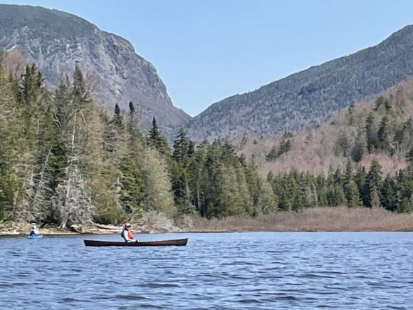 A Crooked Canes paddling outing on Henderson Lake in the Adirondacks with Wallface and Indian Pass in the background.